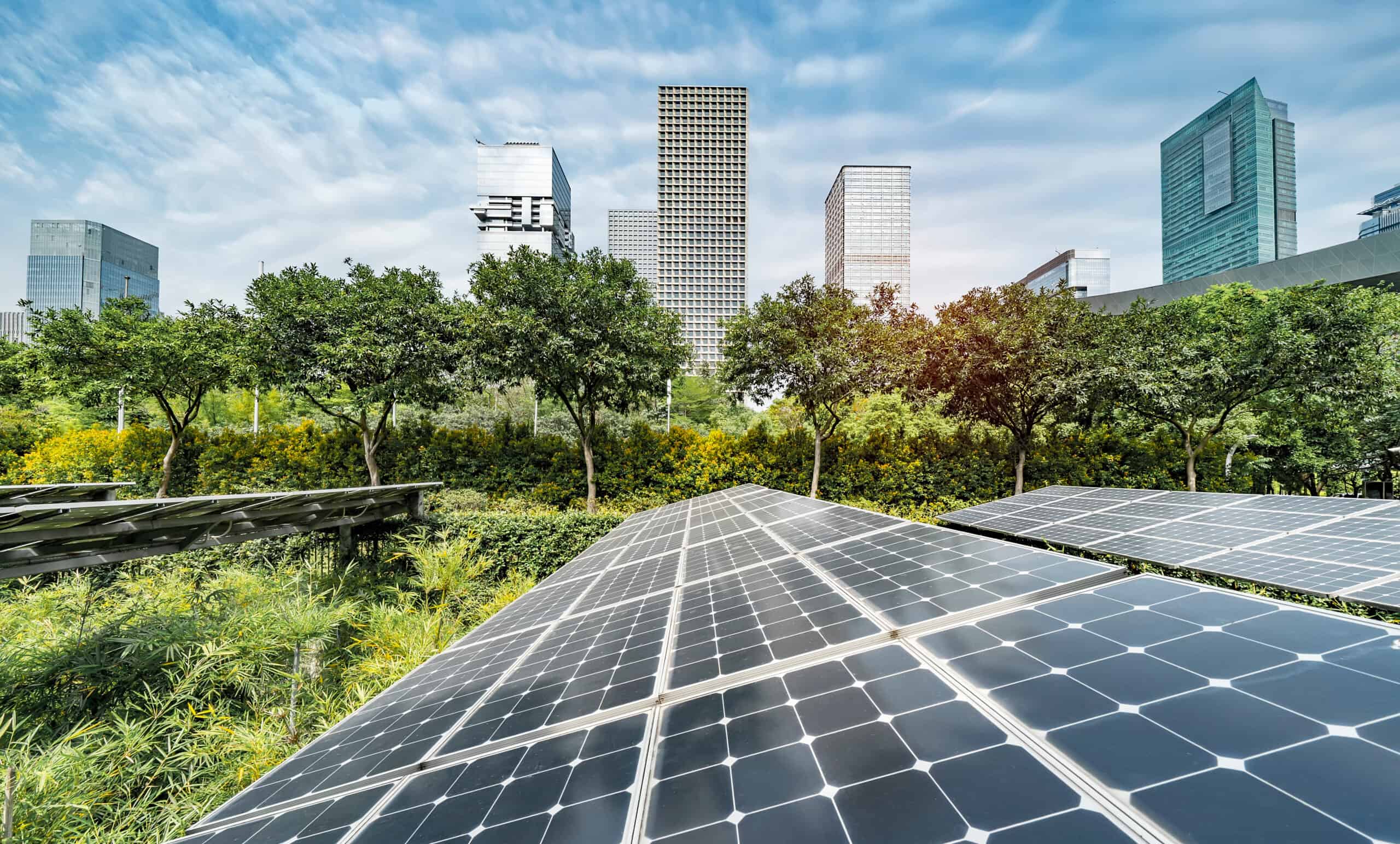 Renewable solar panels in front of urban landscape